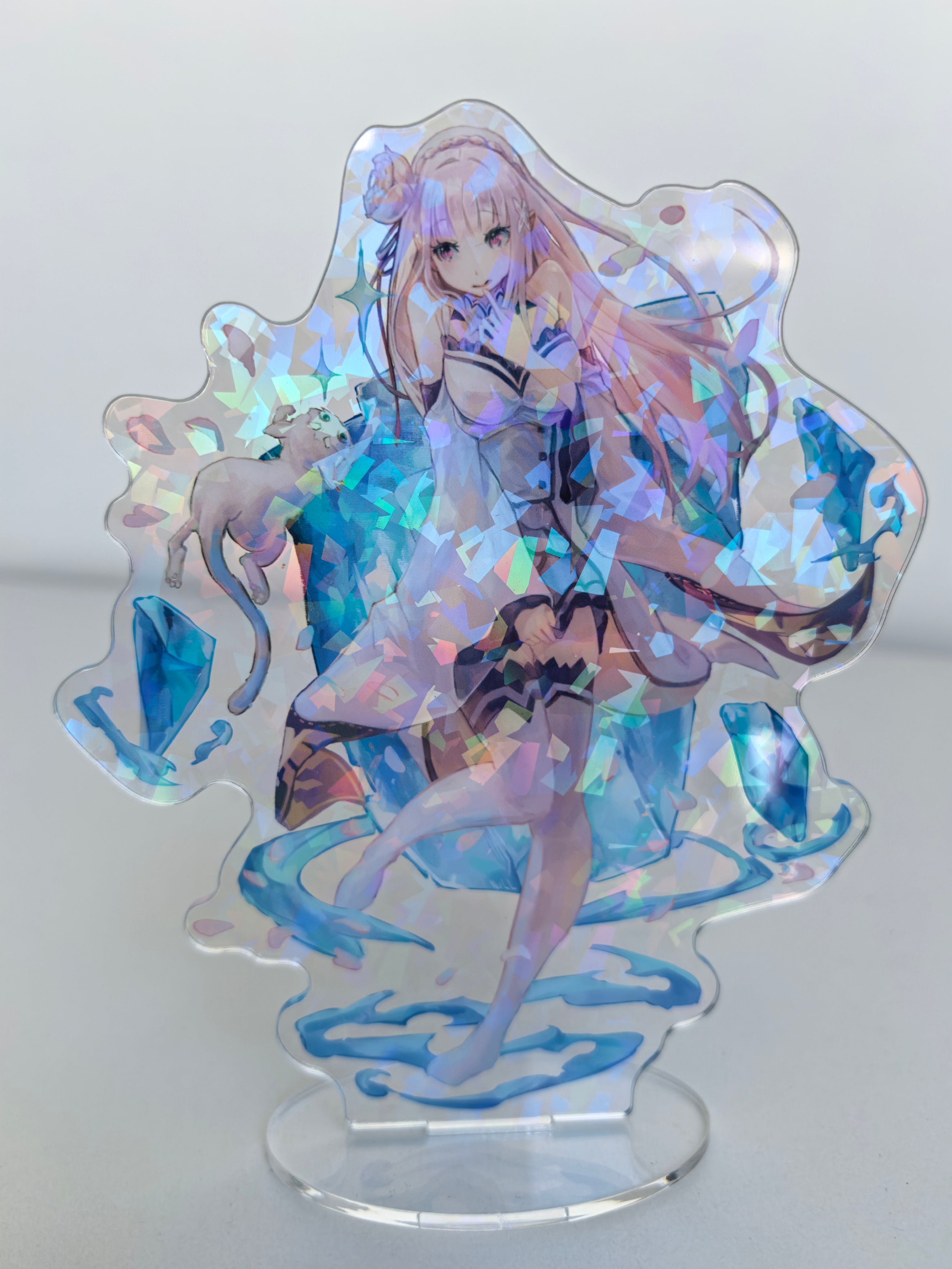 Holographic anime character figurine on a clear stand with blue and purple accents.